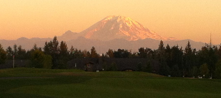 golf course with scenic mountains in the background